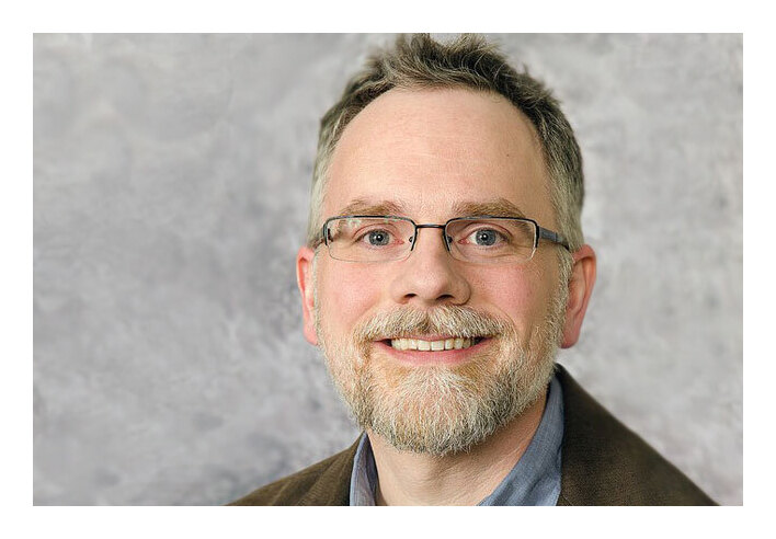 Erik-Moore U of M Archivist (with border)